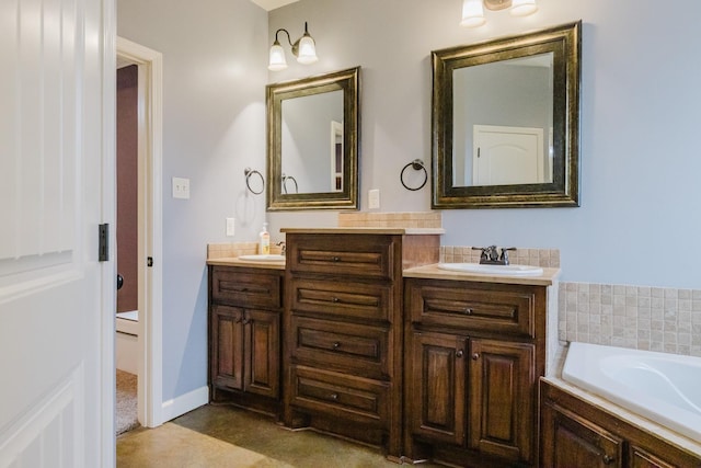 bathroom with vanity and tiled tub