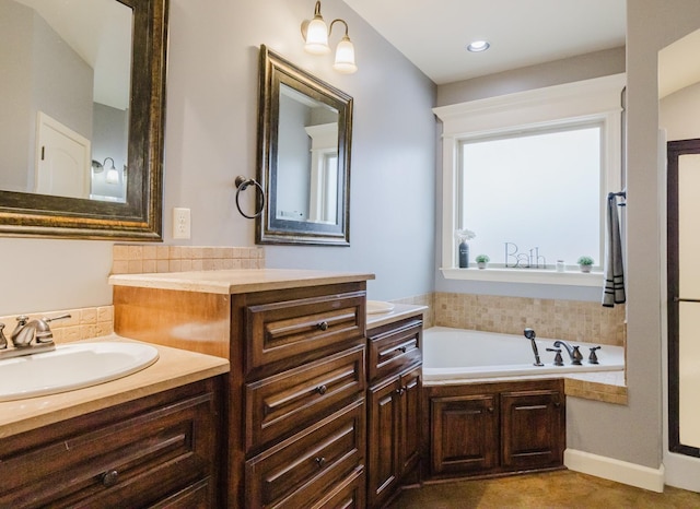 bathroom featuring a tub and vanity