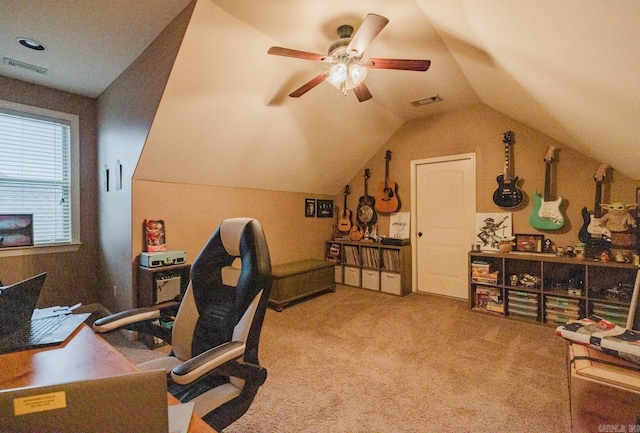 office featuring vaulted ceiling, ceiling fan, and light carpet