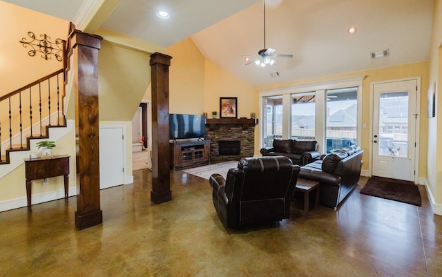 living room with ceiling fan, a stone fireplace, and high vaulted ceiling