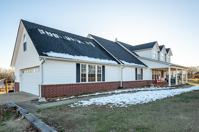 exterior space featuring a garage and a porch