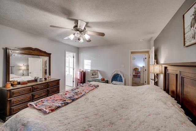 bedroom featuring ceiling fan and a textured ceiling