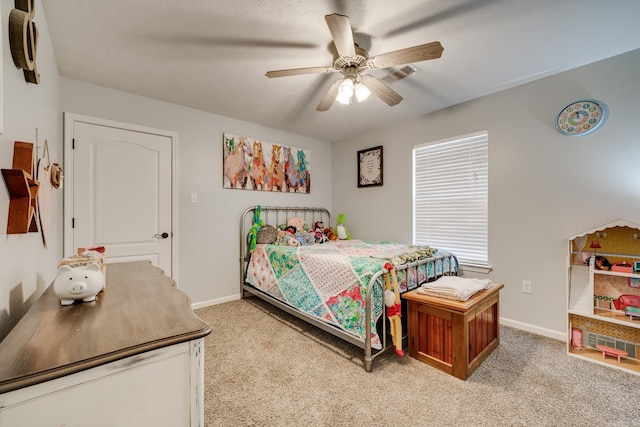 bedroom featuring ceiling fan and light carpet