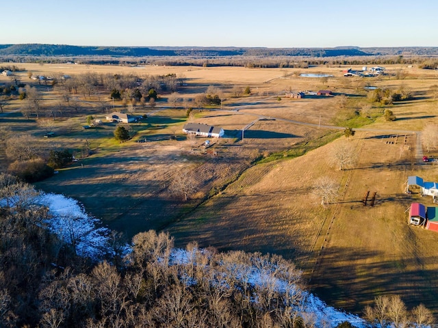 birds eye view of property with a rural view