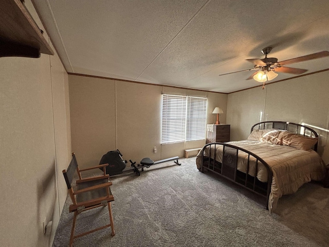 carpeted bedroom featuring ceiling fan, crown molding, and a textured ceiling