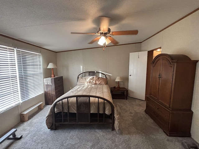 bedroom featuring ceiling fan, crown molding, and carpet flooring