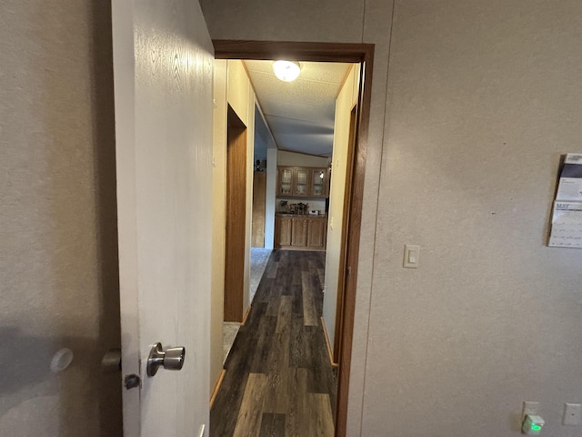 hall with dark wood-type flooring