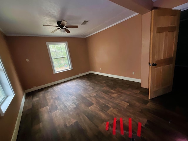 spare room with ceiling fan, dark hardwood / wood-style flooring, and crown molding