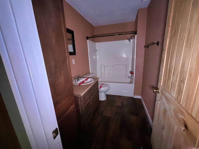 full bathroom with toilet, vanity, tub / shower combination, and hardwood / wood-style flooring