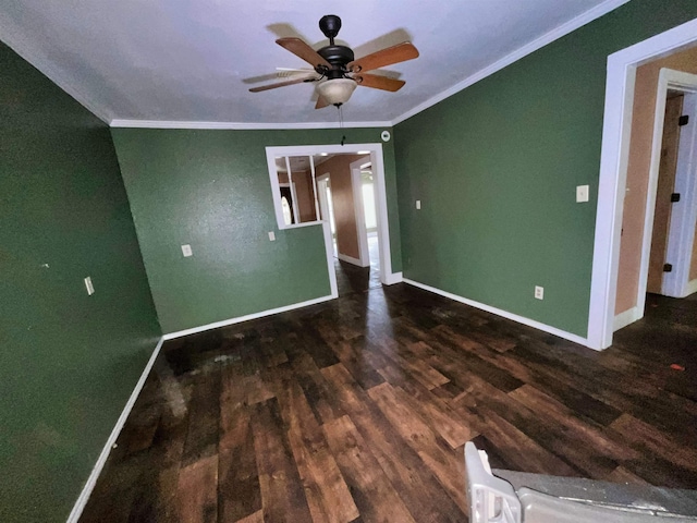 spare room with ceiling fan, crown molding, and dark hardwood / wood-style floors