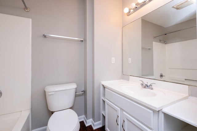 full bathroom featuring toilet, shower / washtub combination, a textured ceiling, and vanity