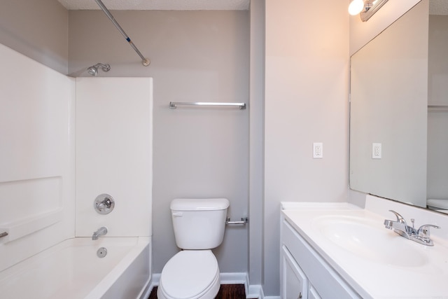 full bathroom with toilet, vanity,  shower combination, and a textured ceiling