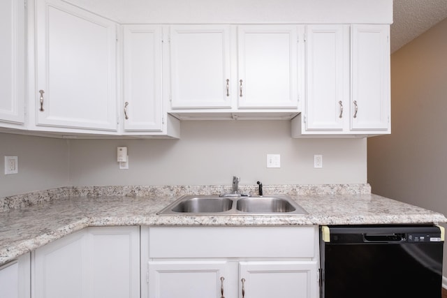 kitchen featuring a textured ceiling, dishwasher, white cabinets, and sink