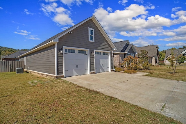 view of property exterior with a lawn, central AC, and a garage