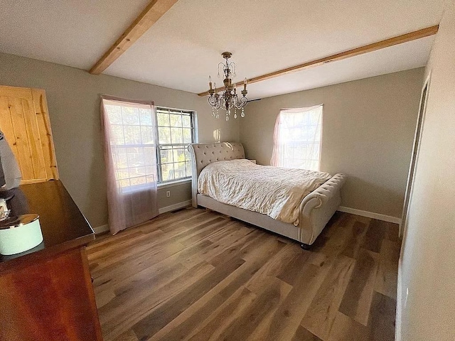 bedroom with a textured ceiling, an inviting chandelier, beam ceiling, and dark hardwood / wood-style floors