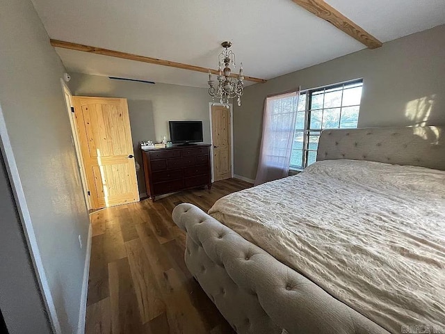 bedroom featuring dark wood-type flooring, beamed ceiling, and an inviting chandelier