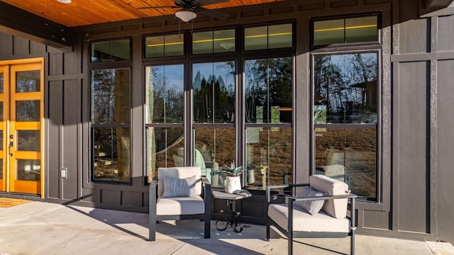 doorway to property with ceiling fan and a patio