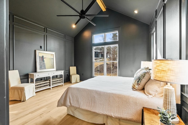 bedroom with hardwood / wood-style flooring and vaulted ceiling