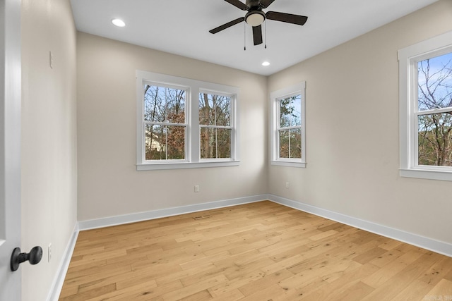 spare room featuring ceiling fan and light wood-type flooring