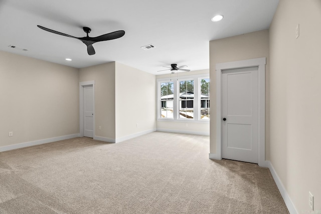 carpeted empty room with ceiling fan