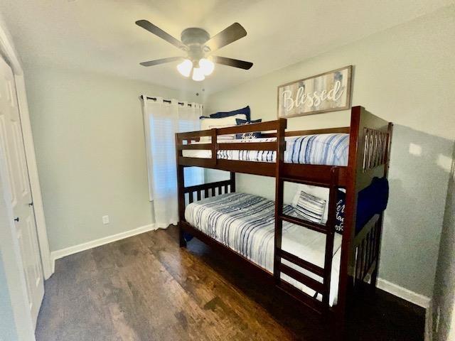 bedroom featuring ceiling fan and dark hardwood / wood-style flooring