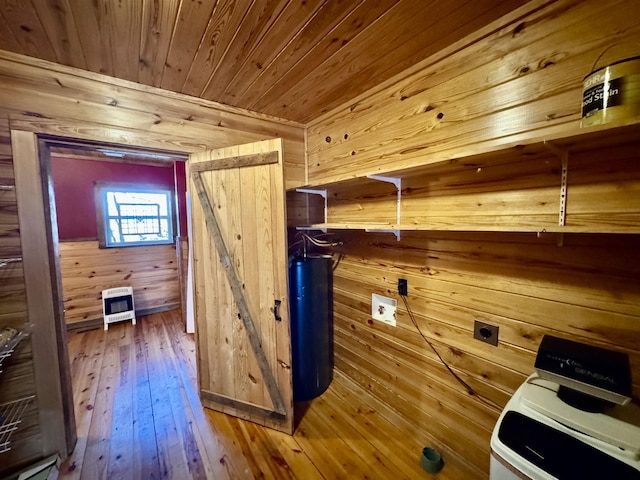 laundry area with wood walls, hardwood / wood-style floors, washer / clothes dryer, heating unit, and wooden ceiling