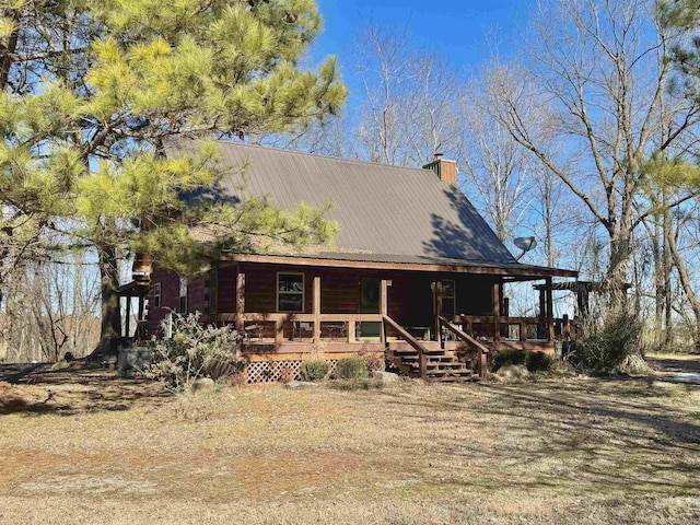 log-style house featuring a porch