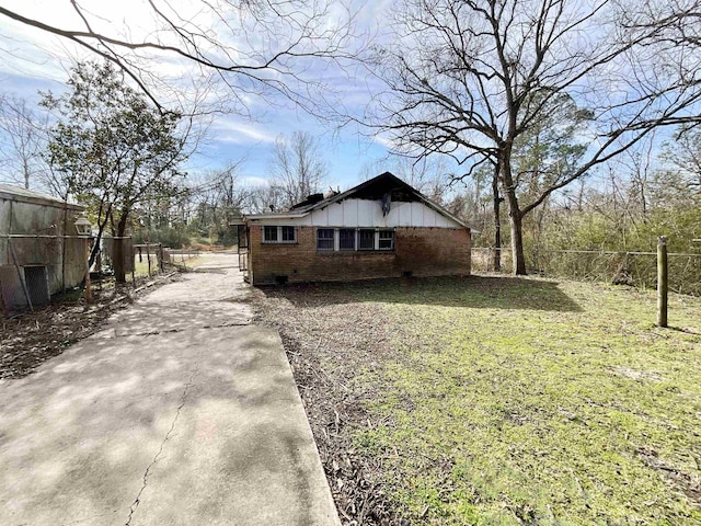 view of home's exterior with a yard