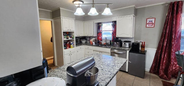 kitchen with light tile patterned floors, white cabinetry, dishwasher, pendant lighting, and sink