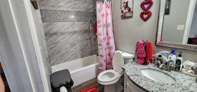 full bathroom featuring hardwood / wood-style flooring, toilet, vanity, and shower / tub combo