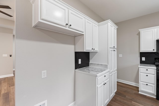 kitchen with ceiling fan, tasteful backsplash, white cabinetry, black range with electric cooktop, and dark hardwood / wood-style flooring