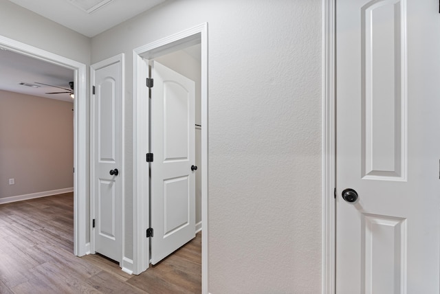 hall with light hardwood / wood-style floors