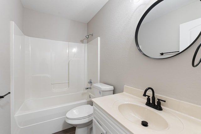 full bathroom with toilet, washtub / shower combination, and vanity