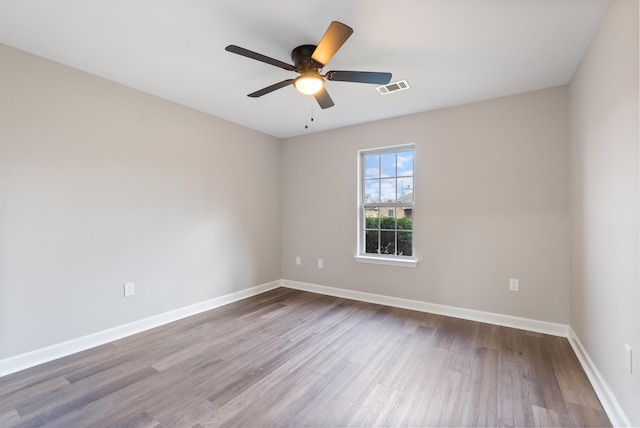 spare room featuring ceiling fan and light wood-type flooring