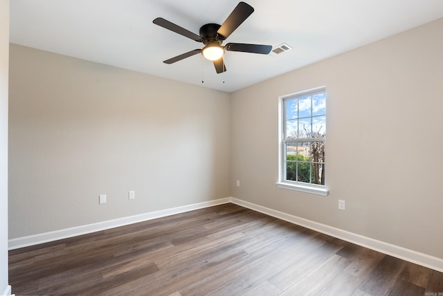 spare room featuring ceiling fan and hardwood / wood-style flooring