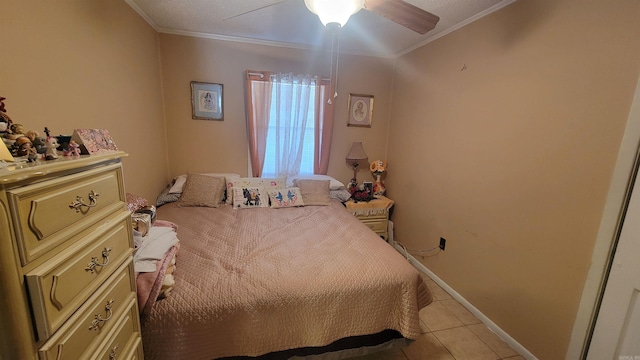 tiled bedroom featuring ceiling fan and ornamental molding