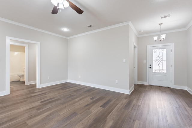 foyer featuring ceiling fan with notable chandelier, dark hardwood / wood-style floors, and crown molding