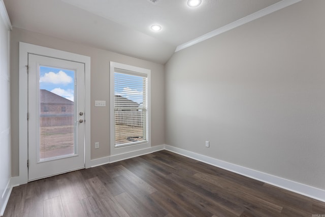 doorway to outside with vaulted ceiling, dark wood-type flooring, and crown molding