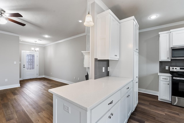 kitchen featuring white cabinetry, appliances with stainless steel finishes, tasteful backsplash, decorative light fixtures, and ornamental molding