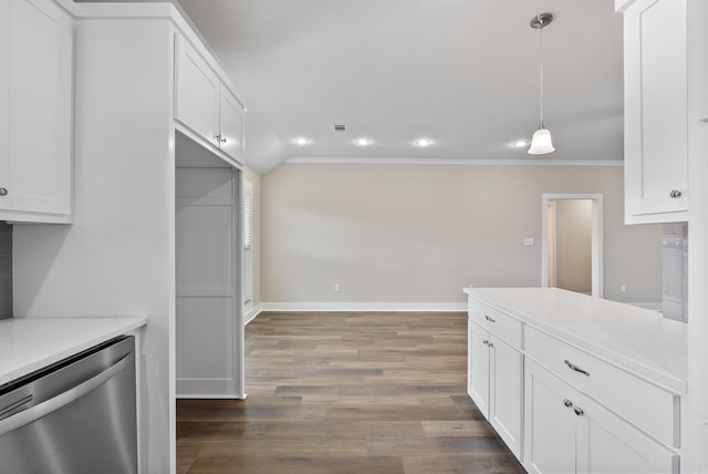 kitchen with dark hardwood / wood-style floors, pendant lighting, stainless steel dishwasher, ornamental molding, and white cabinets