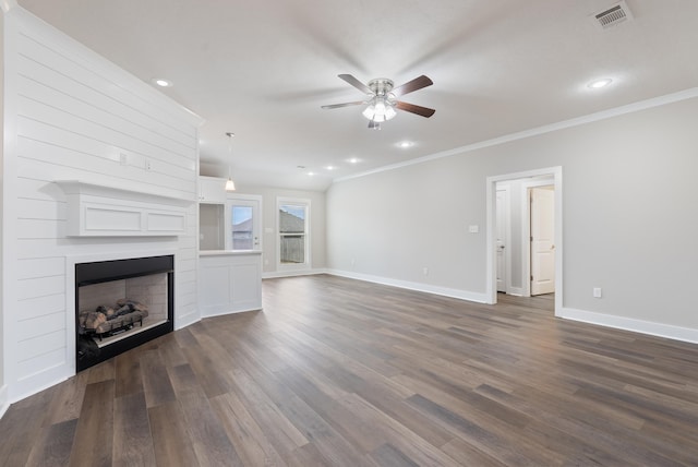 unfurnished living room with ceiling fan, dark hardwood / wood-style floors, and crown molding