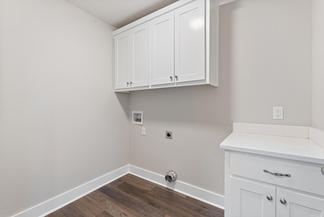 laundry area with dark hardwood / wood-style floors, washer hookup, hookup for an electric dryer, and cabinets