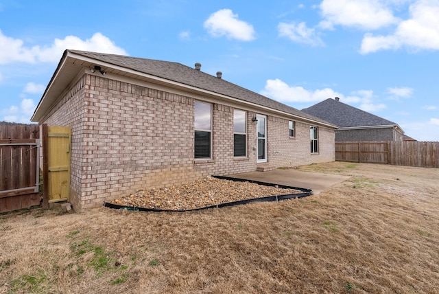 rear view of house with a patio