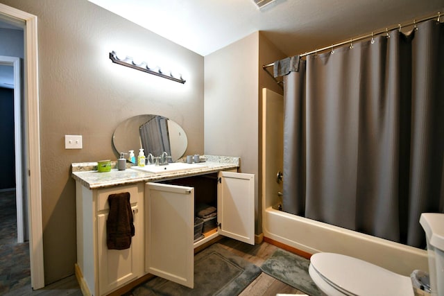 full bathroom featuring hardwood / wood-style flooring, toilet, vanity, and shower / bathtub combination with curtain