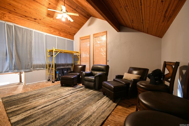 cinema room with ceiling fan, wooden ceiling, and vaulted ceiling with beams