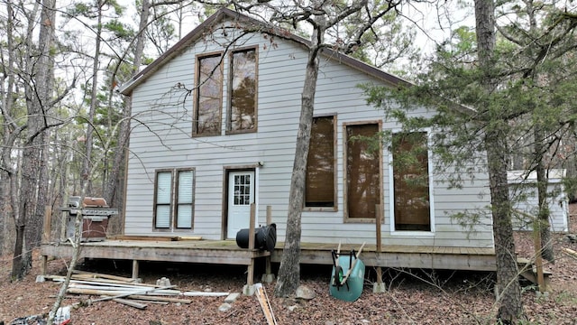 rear view of house featuring a deck