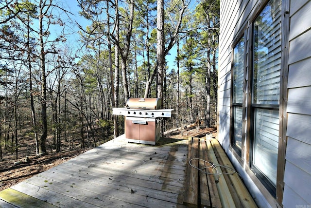 wooden terrace featuring grilling area