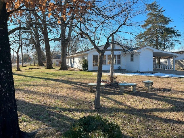 view of yard with a carport