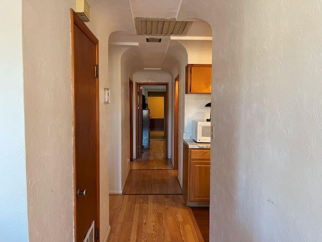 hall with light wood-type flooring