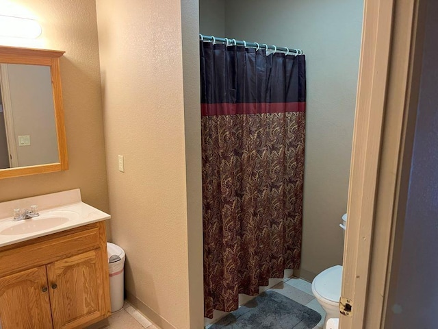 bathroom with toilet, tile patterned flooring, a shower with curtain, and vanity